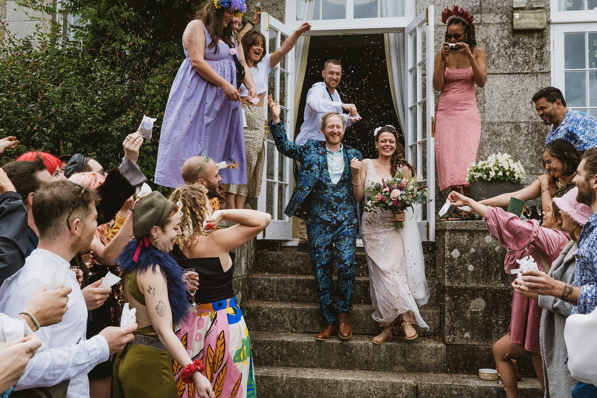 Bride and groom celebrating with guests.
