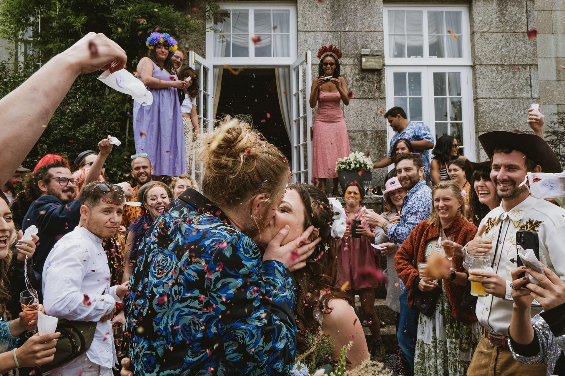 Colehayes Park wedding photography. Wedding celebration with confetti and guests