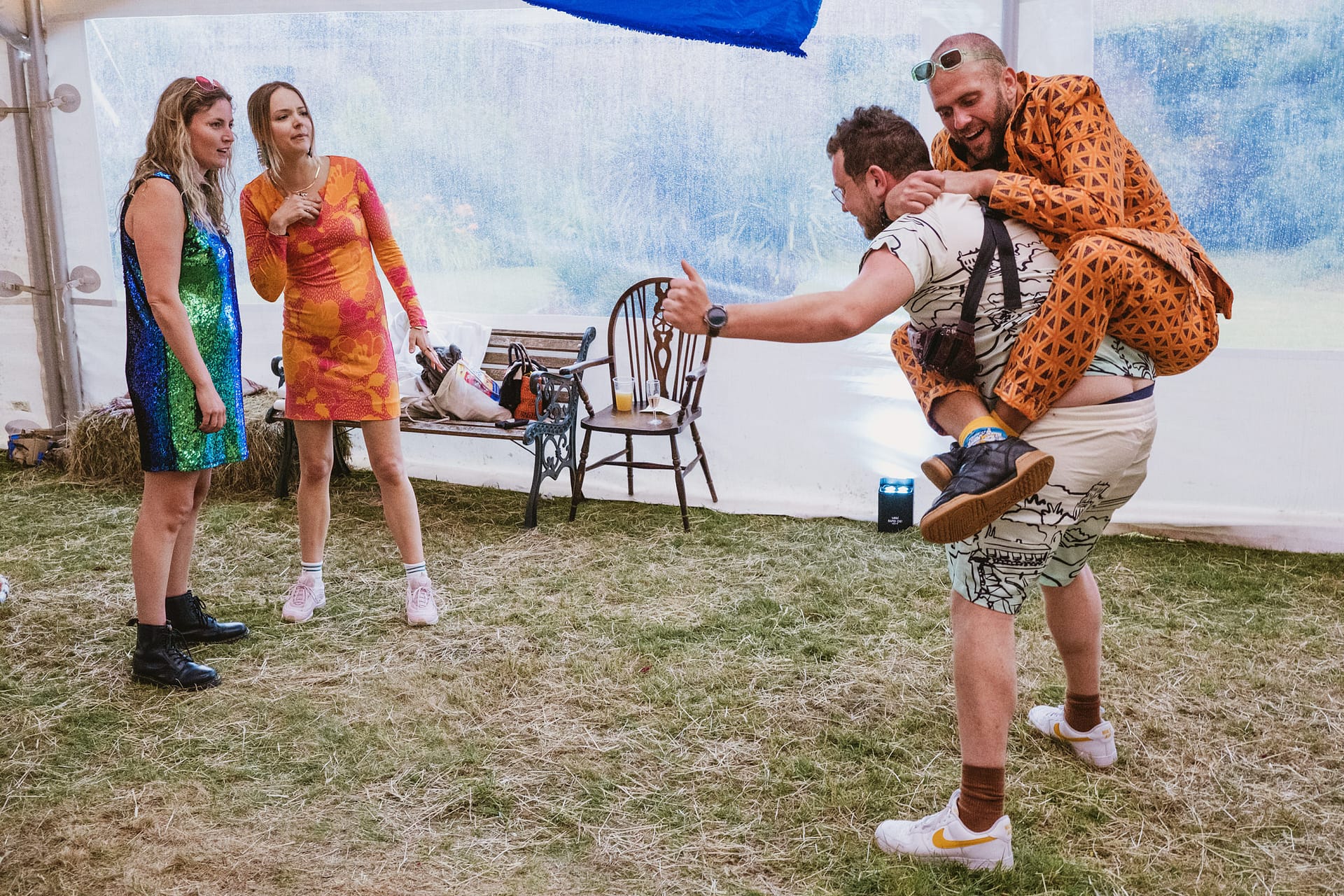 Group in colourful outfits at a fun event.
