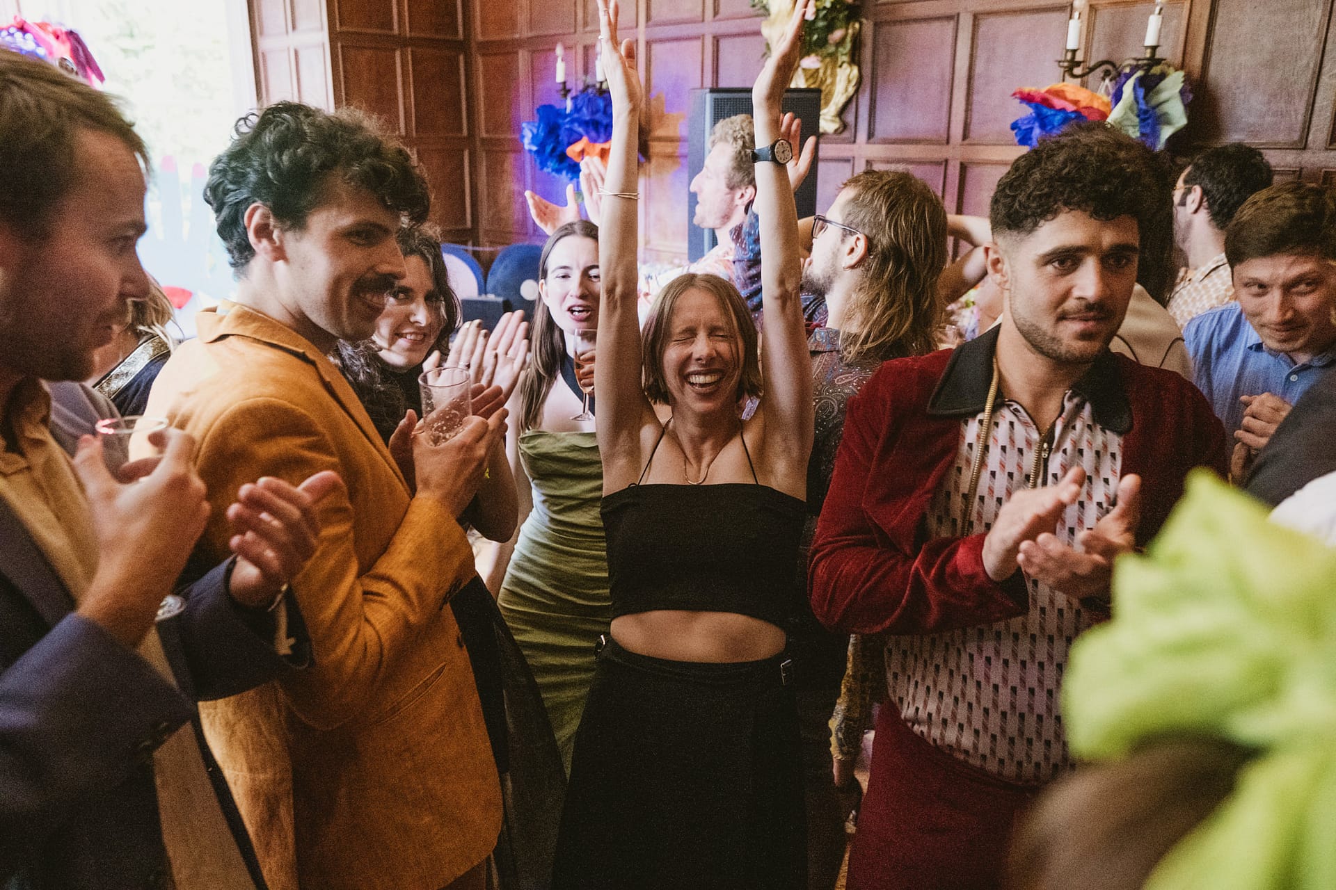 People celebrating at a lively indoor party.