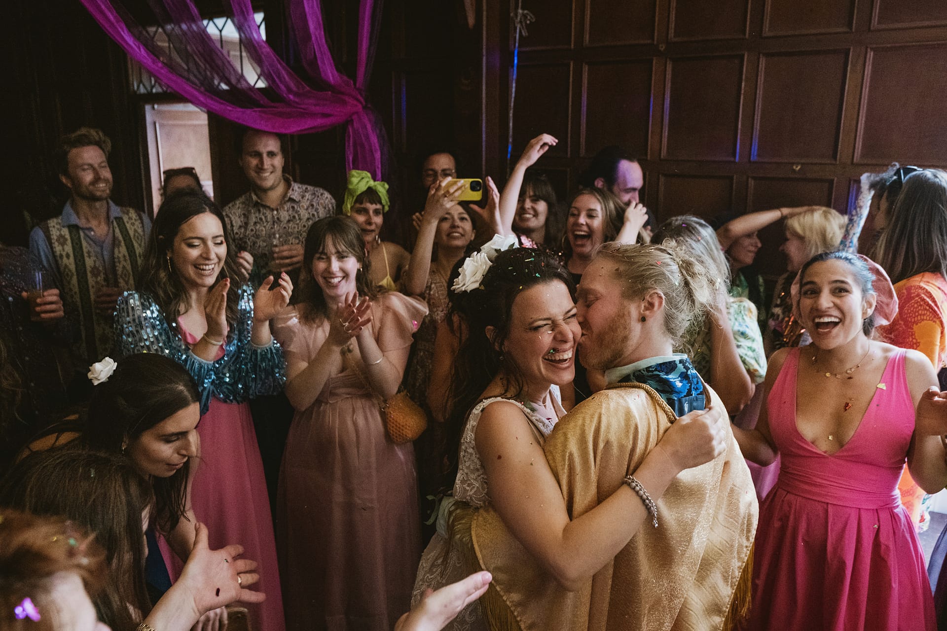 Wedding celebration with dancing and laughter.