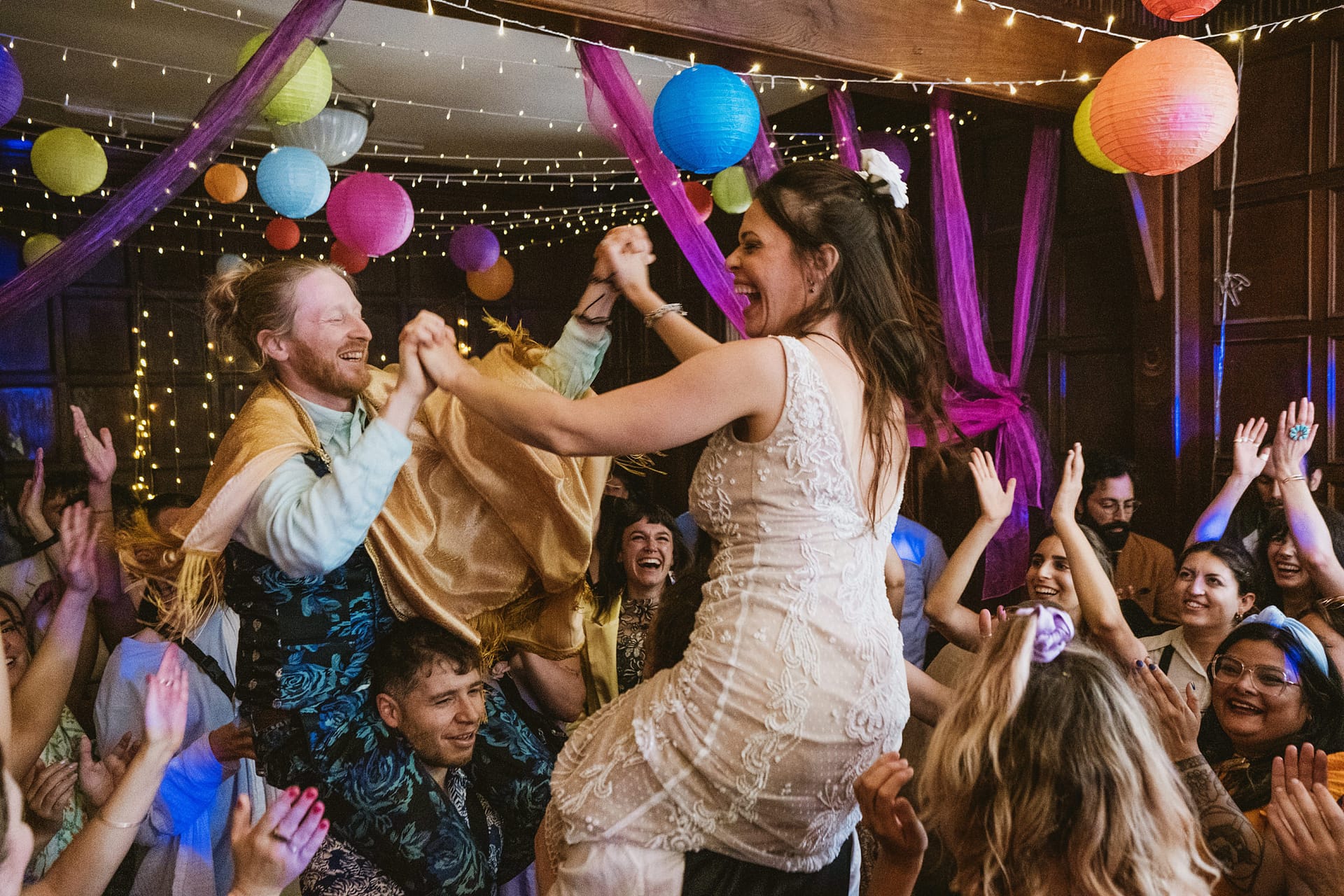 Joyful wedding celebration with dancing guests