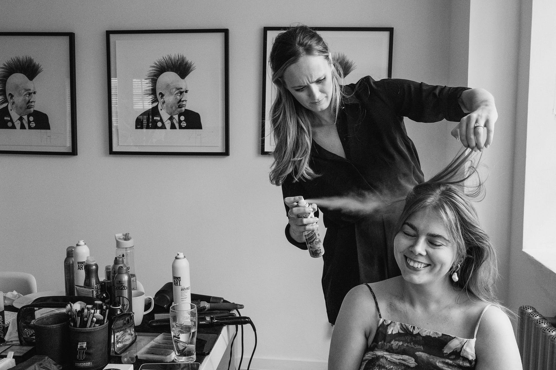 Woman gets hair styled with spray at Haybridge House