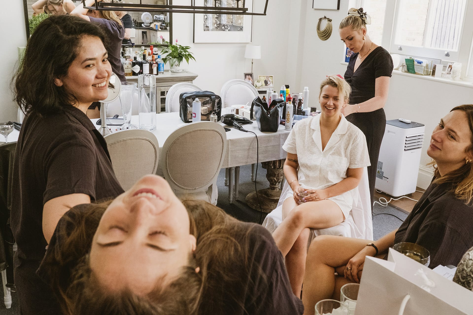 Women enjoying a cheerful gathering indoors.
