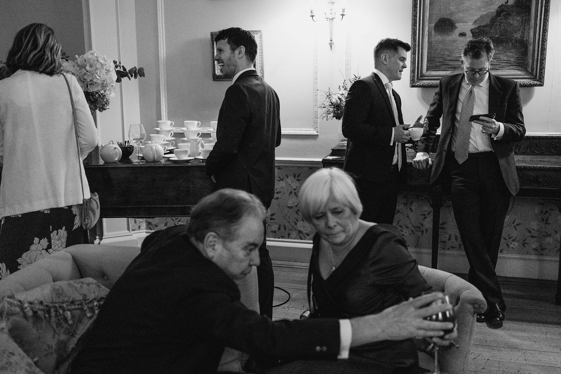 People socialising at a formal gathering