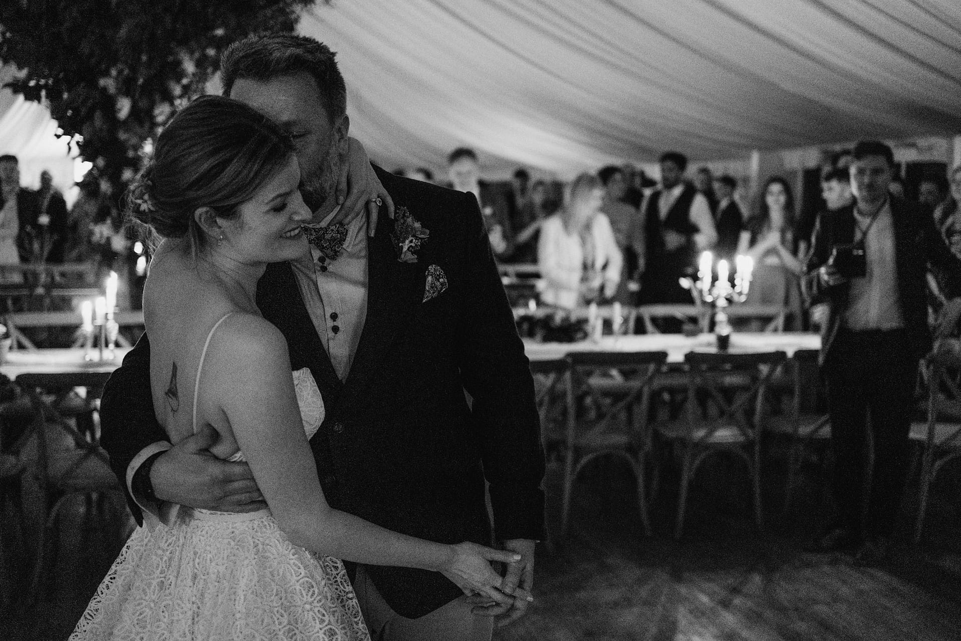 Bride and groom dancing at wedding reception.