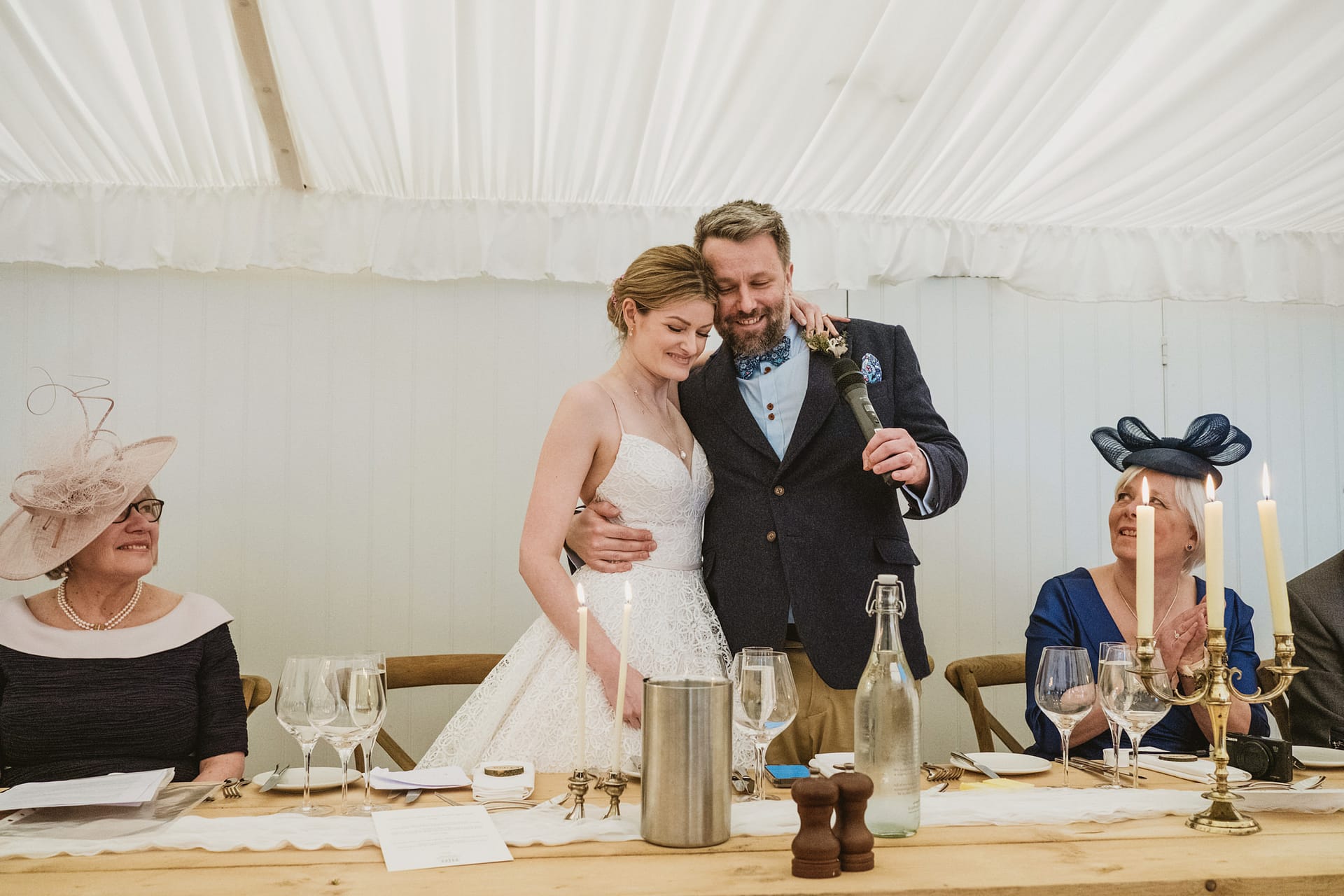 Bride and groom giving wedding speech