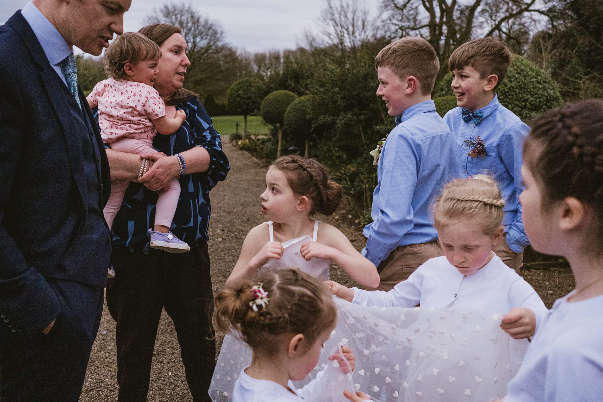Group of children and adults at outdoor event.