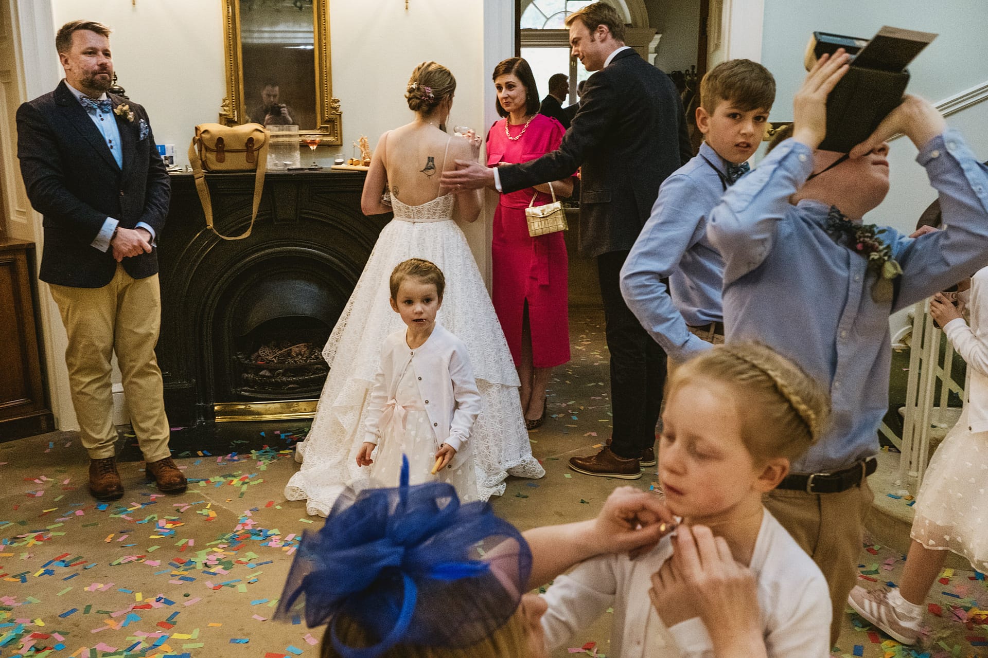 Wedding reception with guests and children playing.