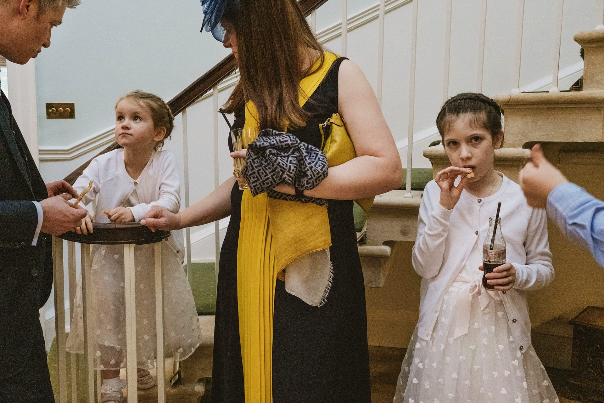 Children enjoying snacks at an indoor gathering.