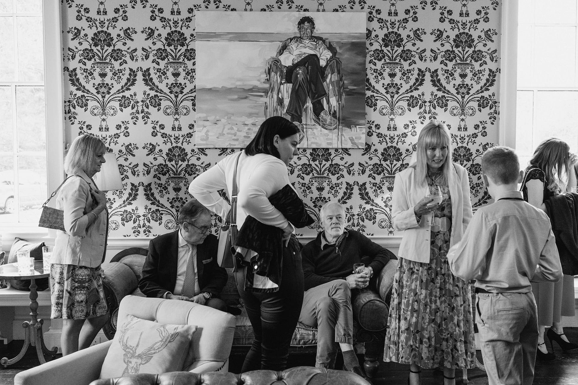 People socialising in a vintage-themed room gathering.