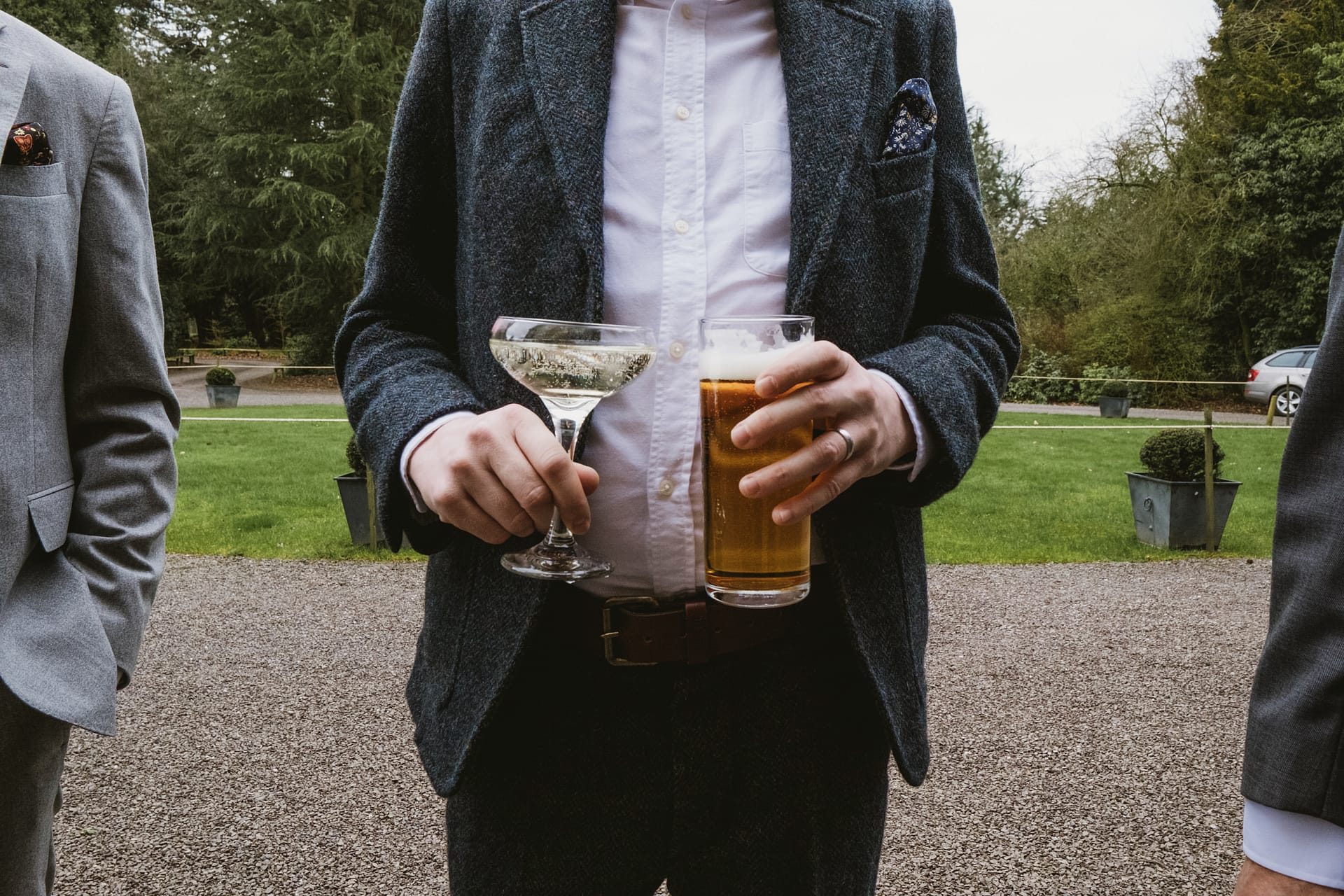 Man holding beer and champagne outdoors