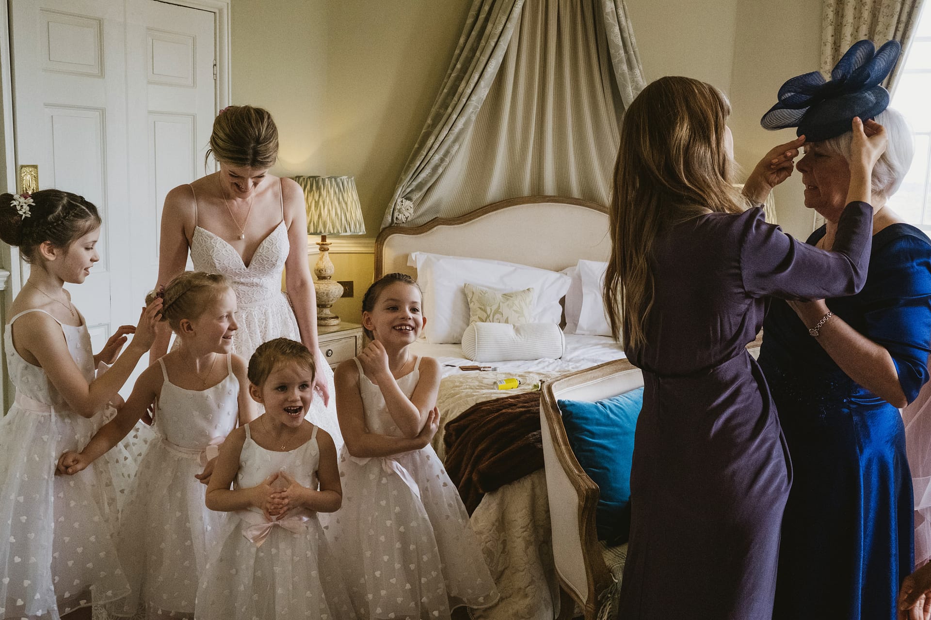 Bride and bridesmaids getting ready for wedding.