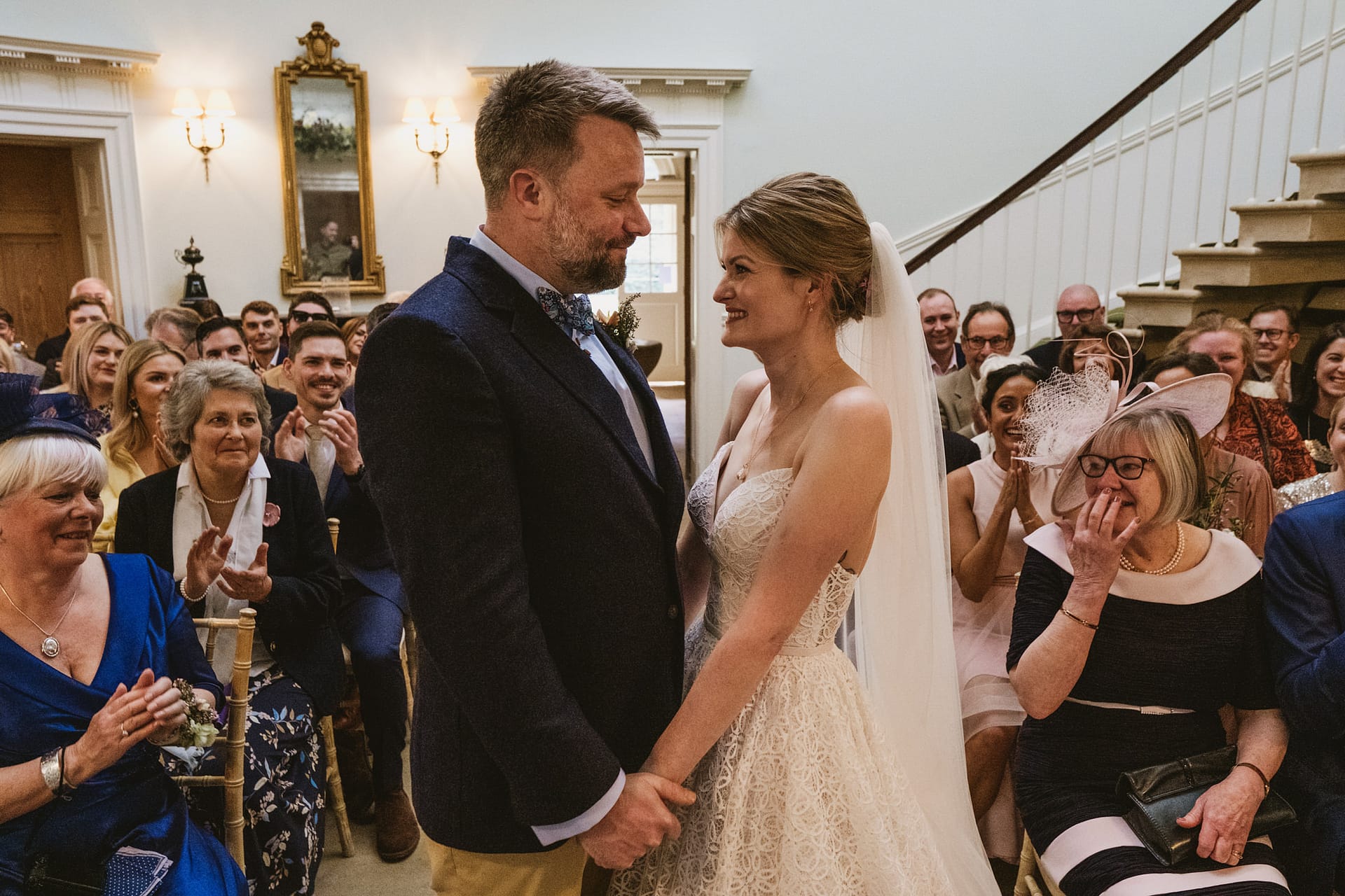 Bride and groom smiling at their wedding ceremony.