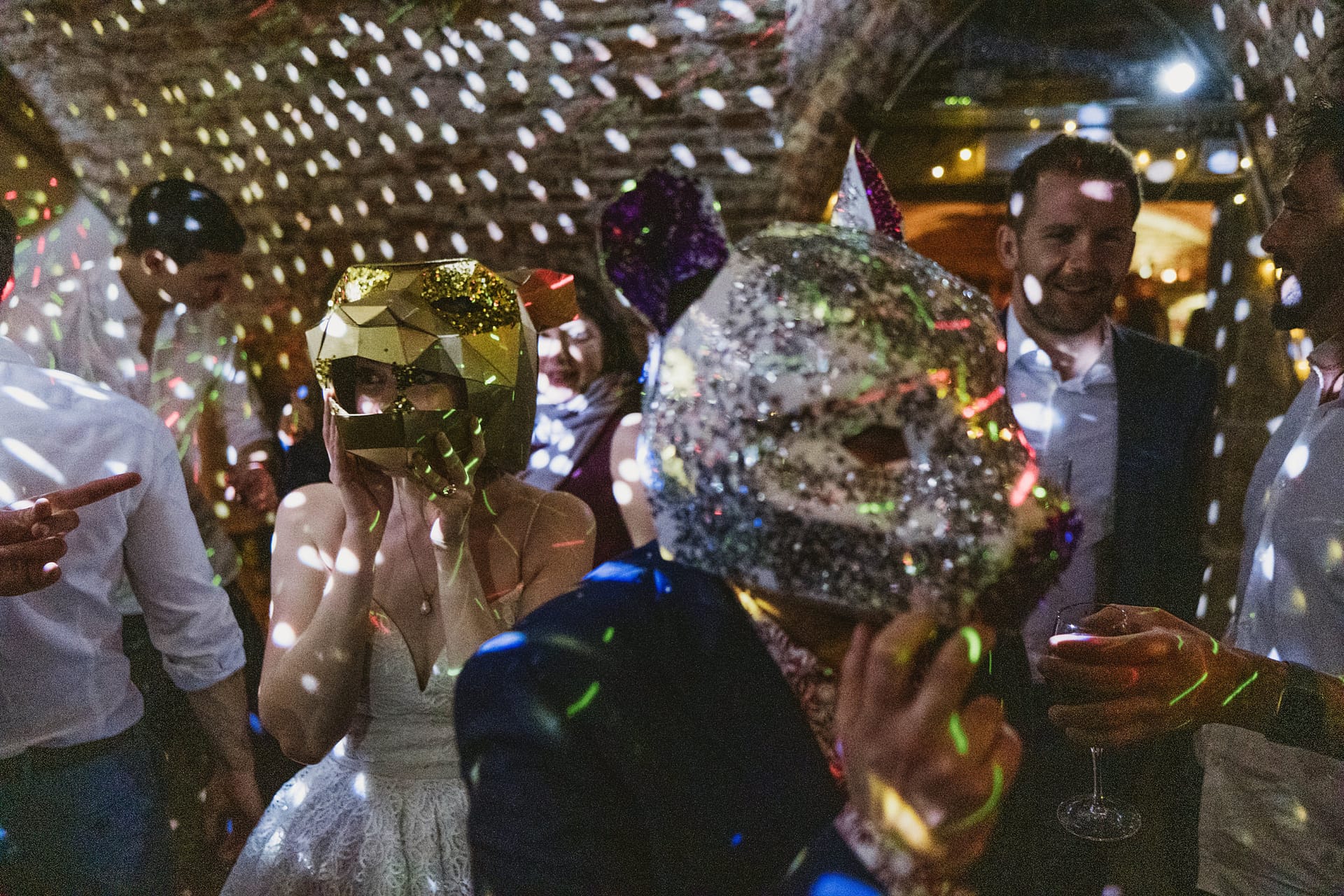 Party with guests wearing colourful animal masks.