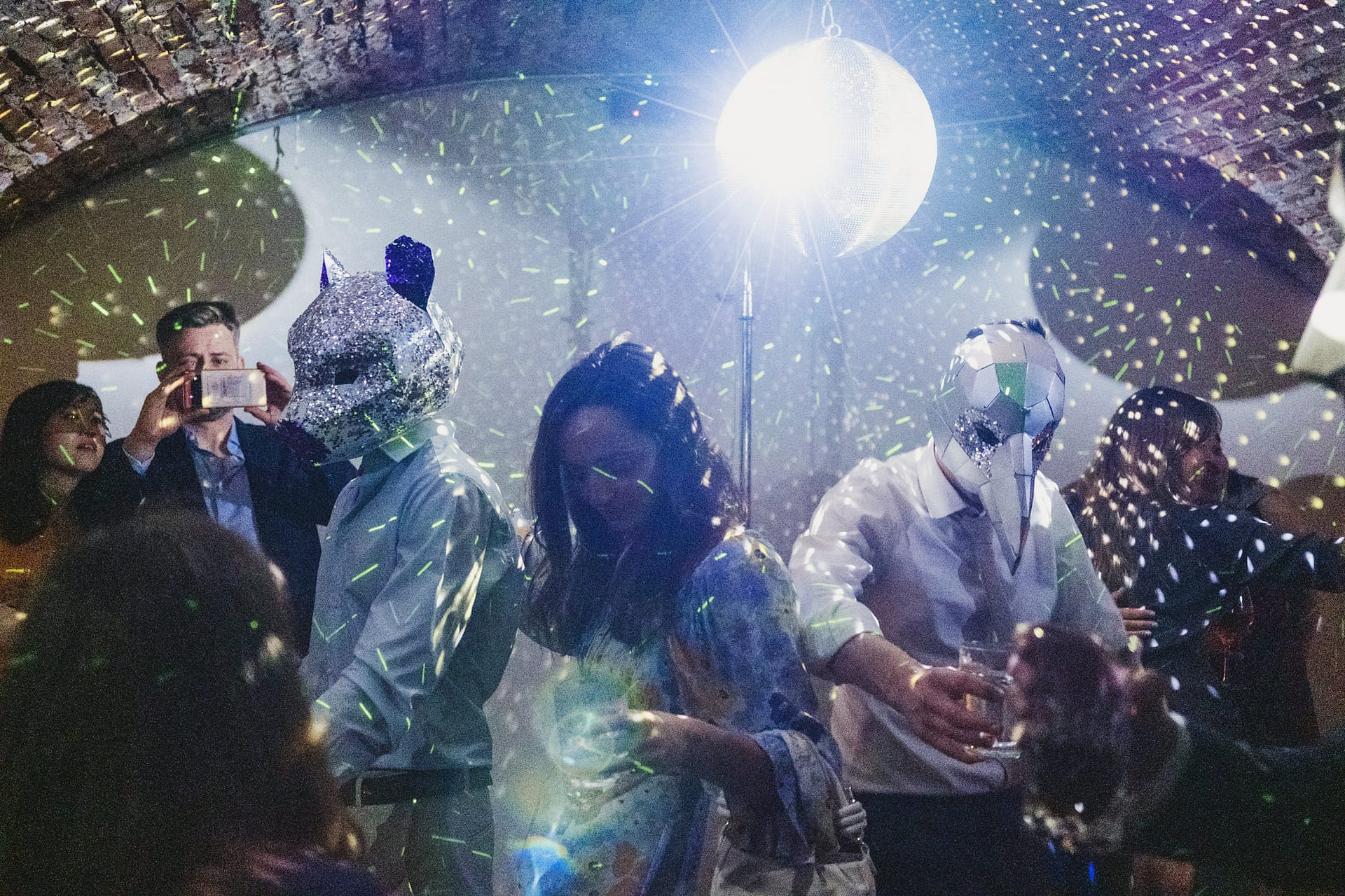 People dancing with animal masks at party