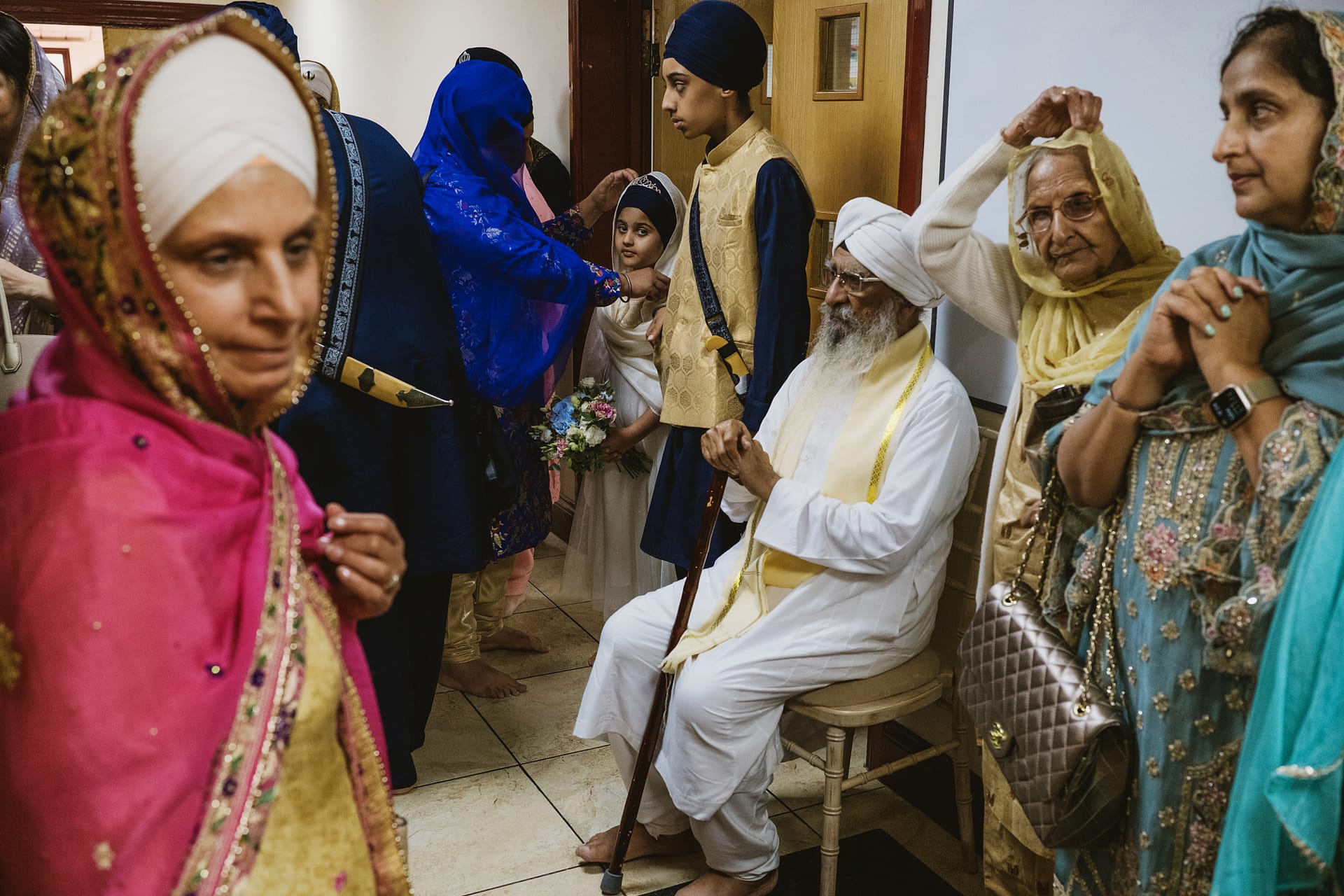 Group of people in traditional attire at a gathering.