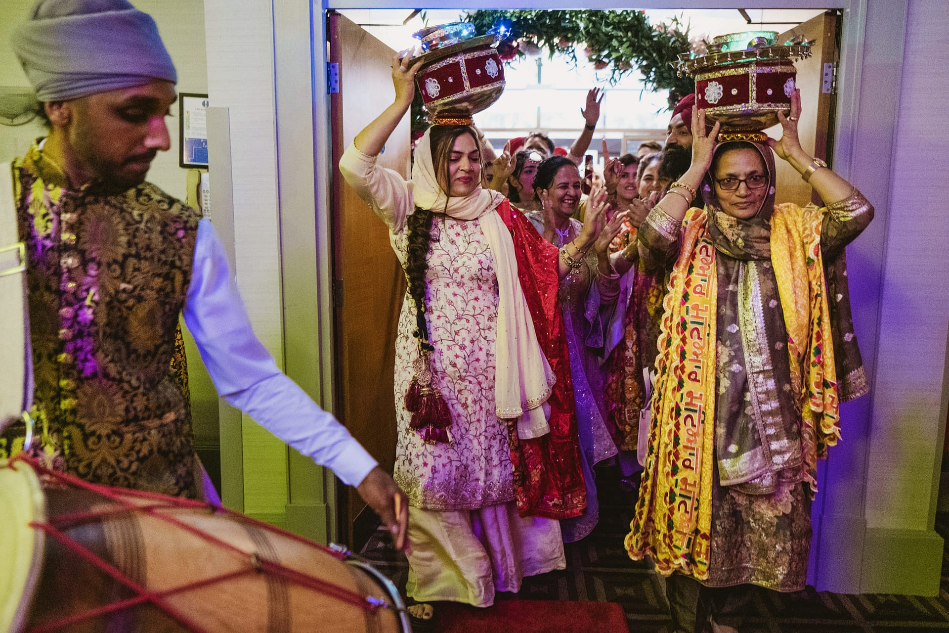 Traditional Punjabi celebration with music and joyful participants.
