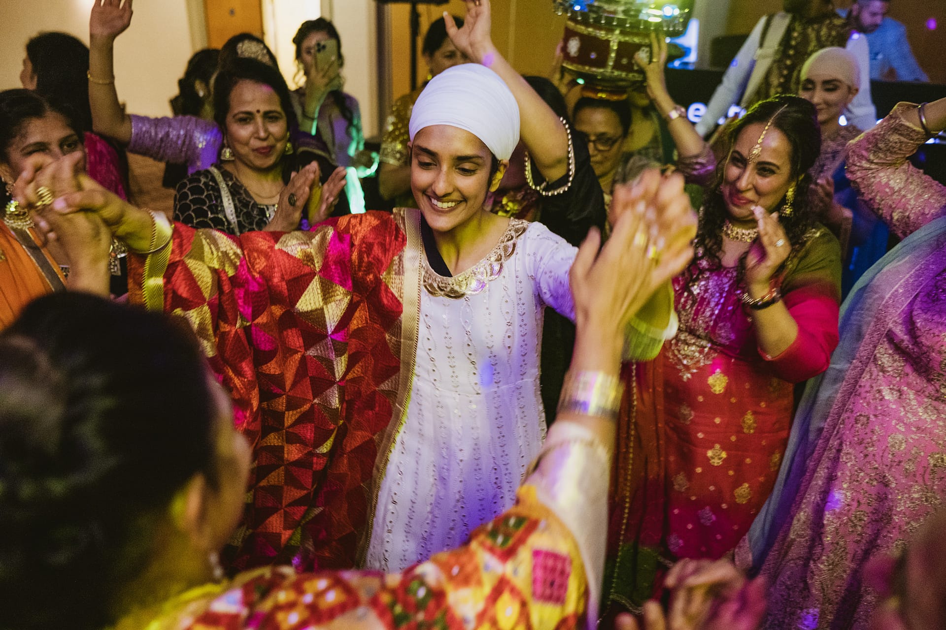 Group dancing at traditional cultural celebration.