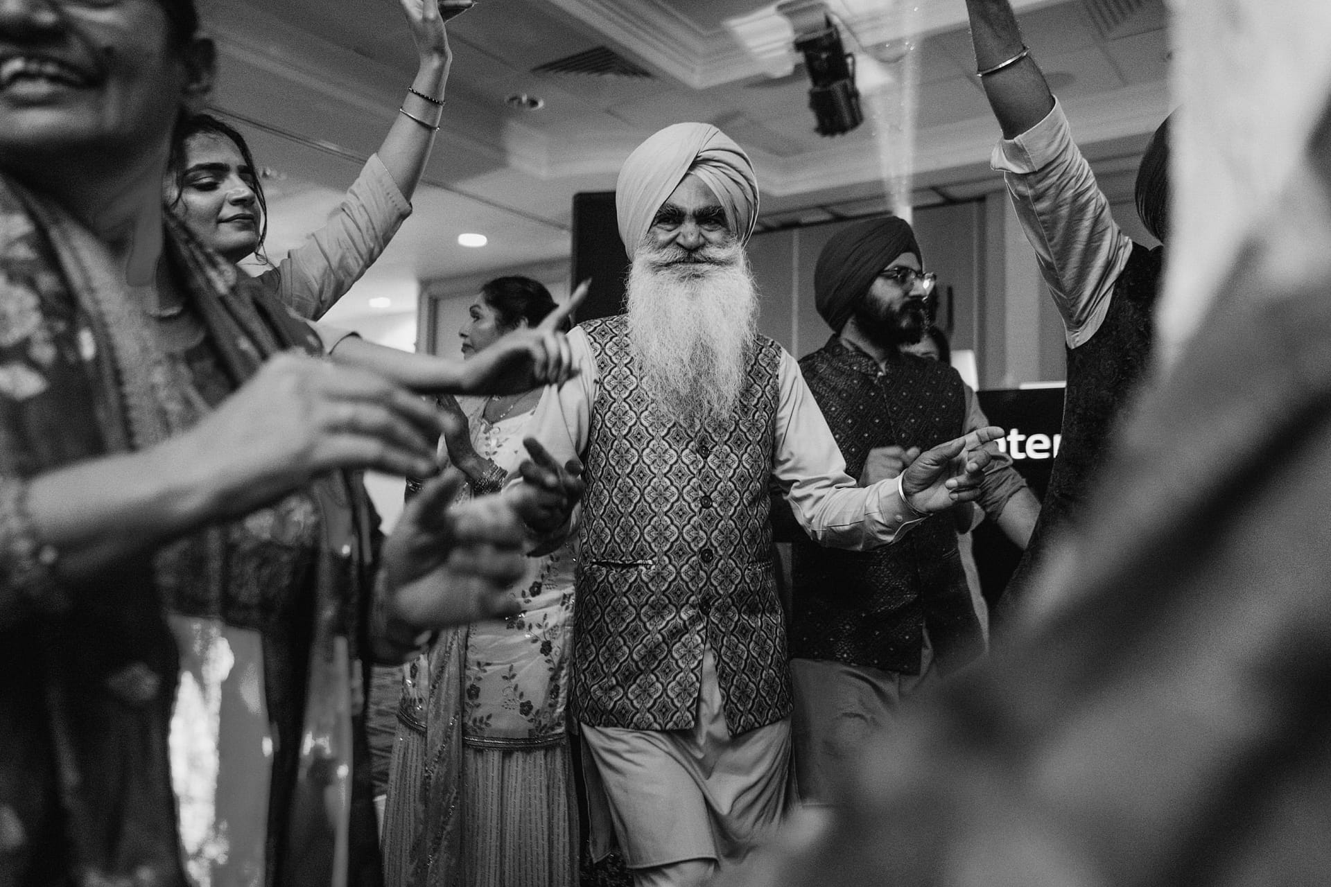 People dancing joyfully at a celebration.