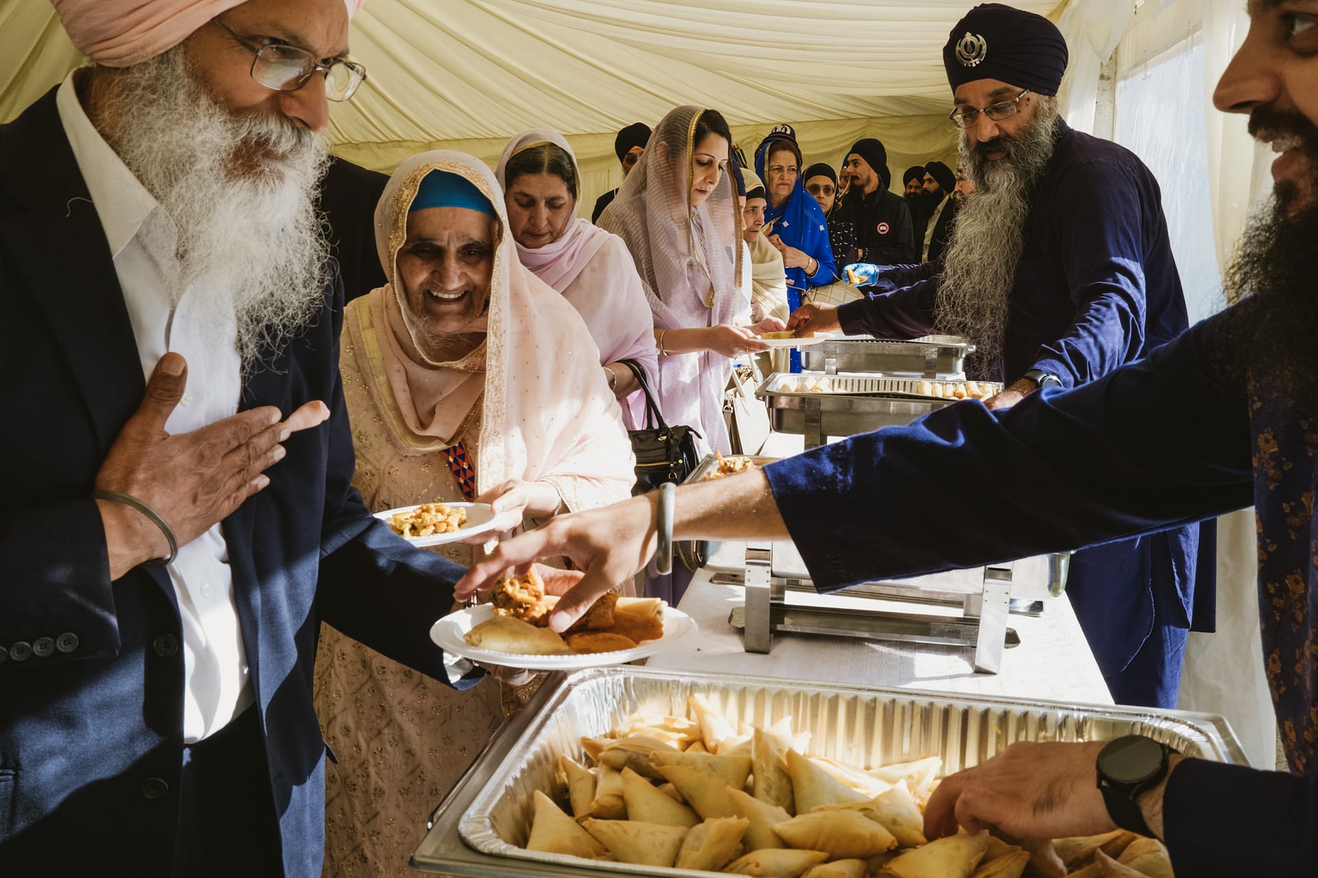 People enjoying food at a community gathering.