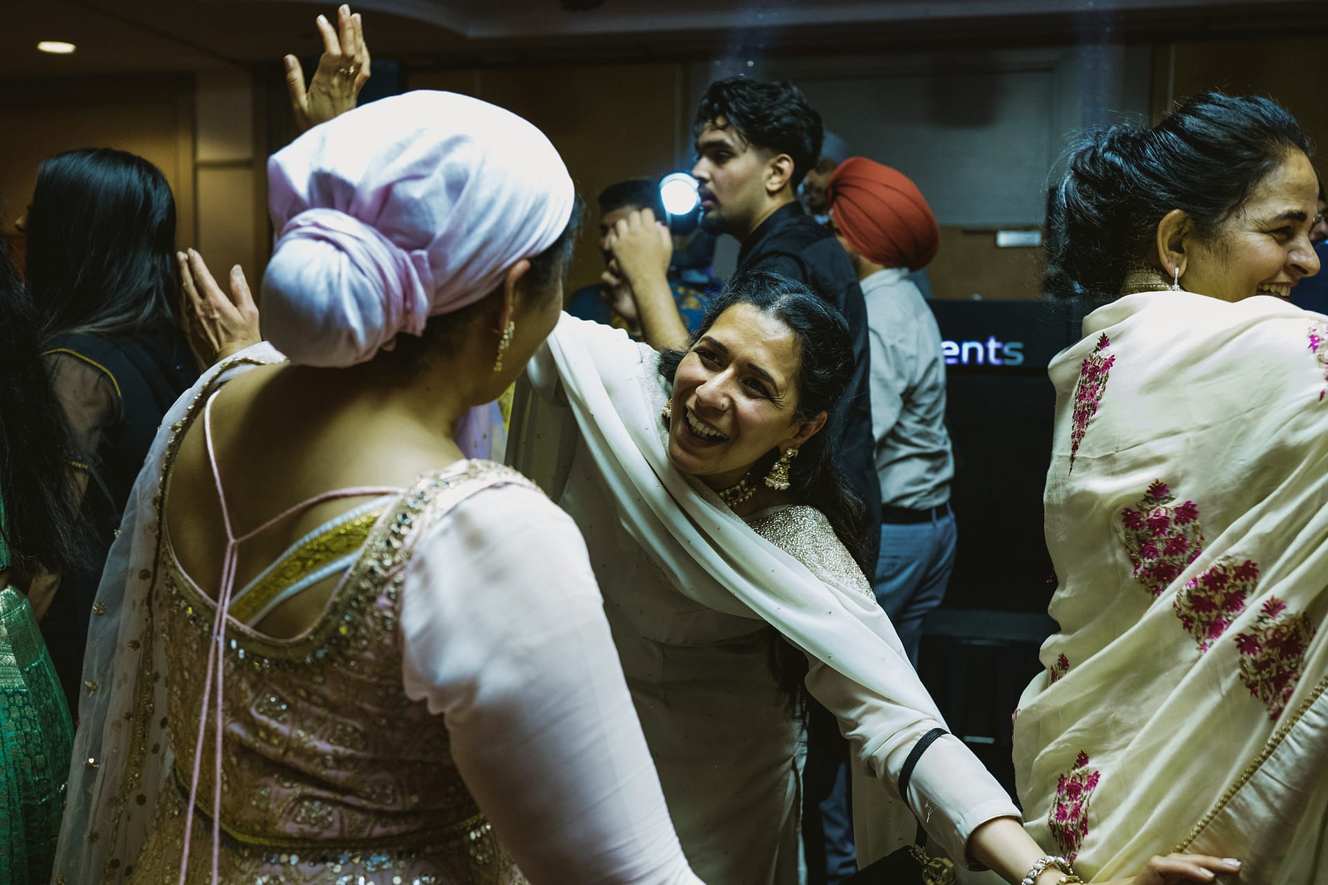 People dancing joyfully at a lively celebration.