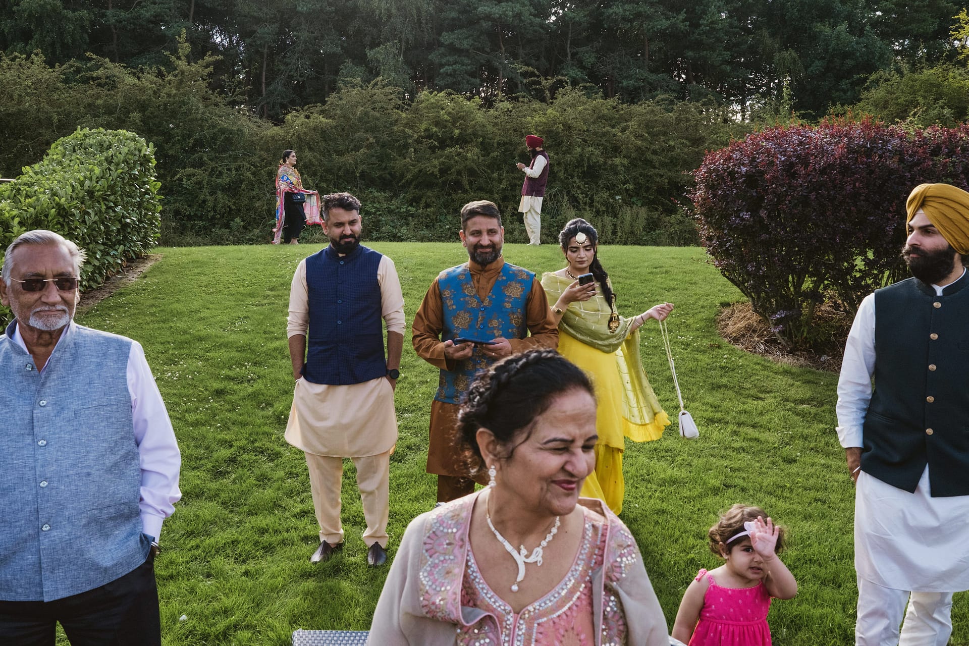 People in vibrant clothes at outdoor gathering