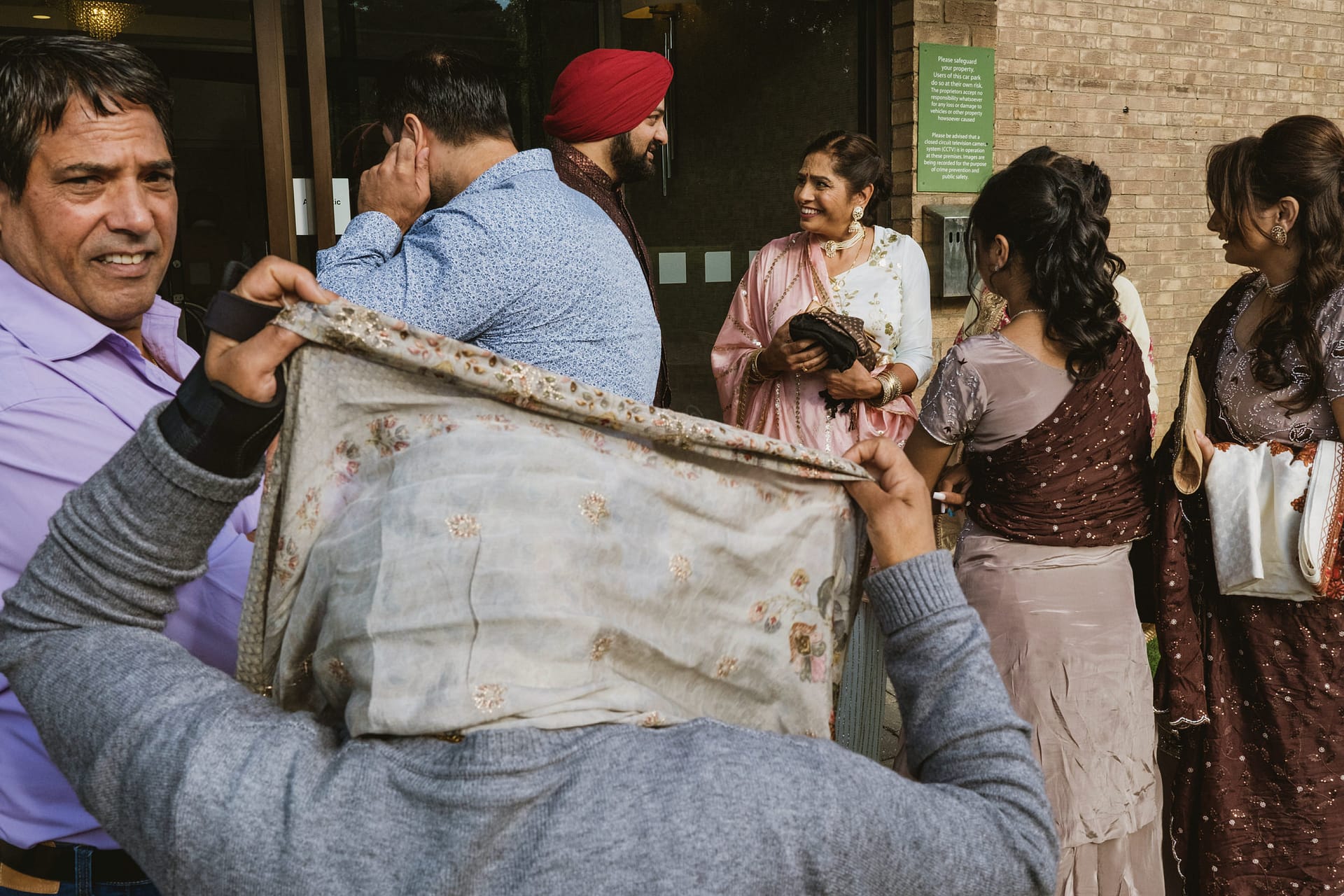 Group of people gathered outside a building