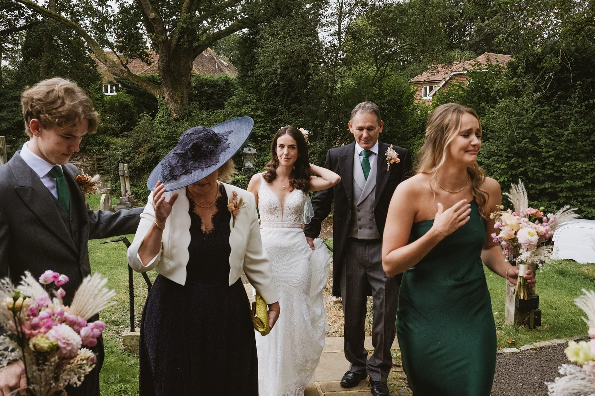 bride, bride's father, bridesmaid, bride's mother and brother all coming into the ceremony