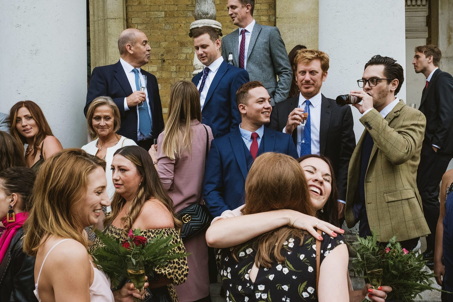 wedding guests outside the asylum chapel