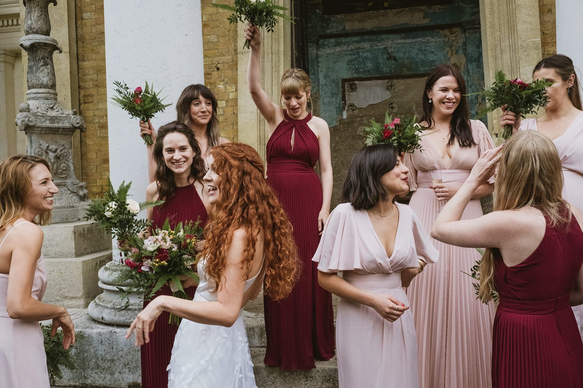 bridesmaids outside the asylum chapel with the bride chatting