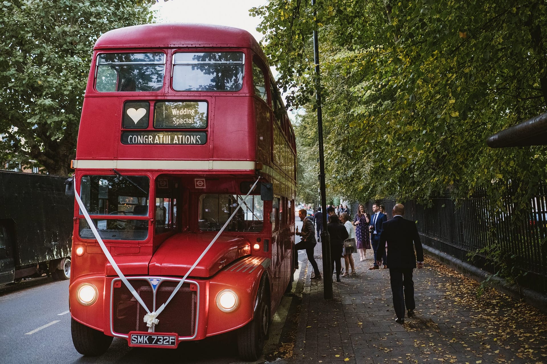 bus arriving to take guests to wedding reception from asylum chapel