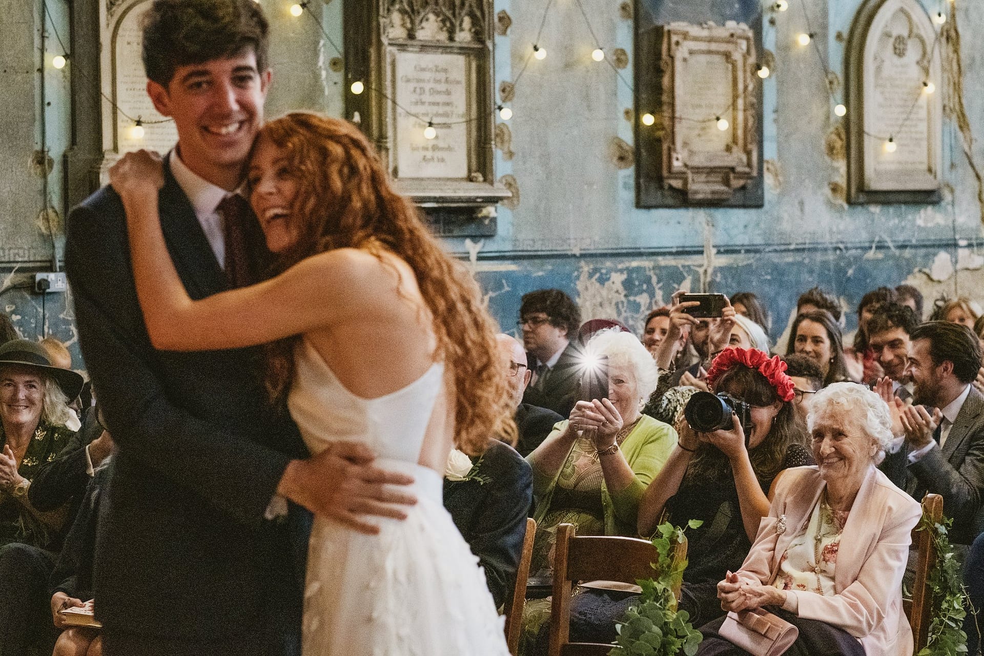 bride and groom hugging during the ceremony at asylum chapel