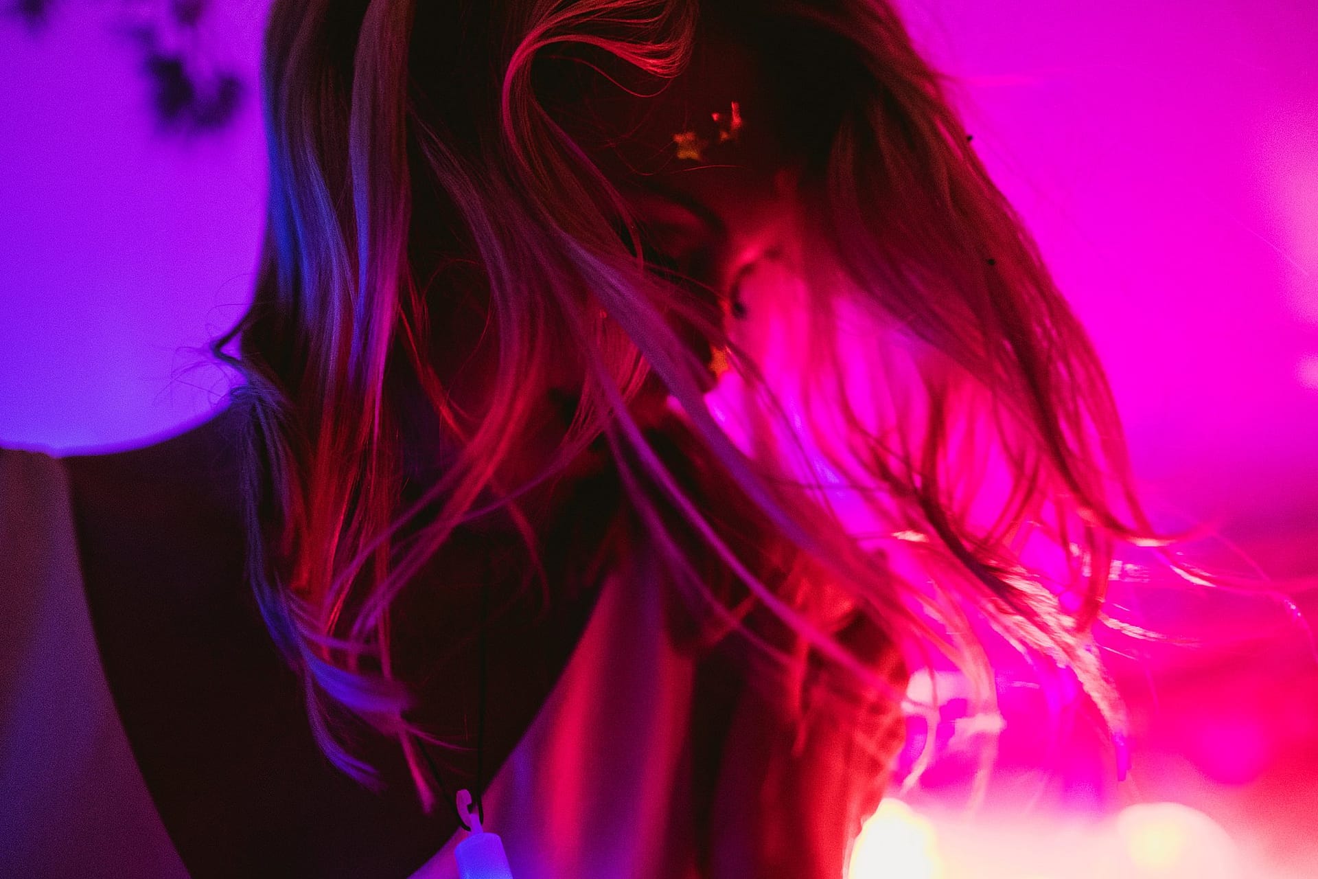 pink light dance floor with bride