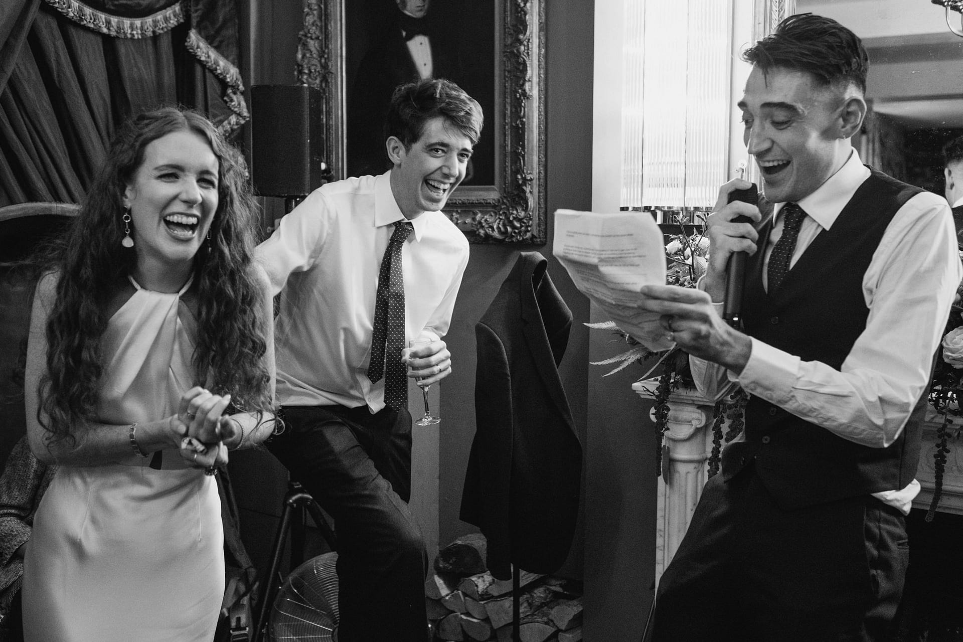 bride and groom listening to best man speech