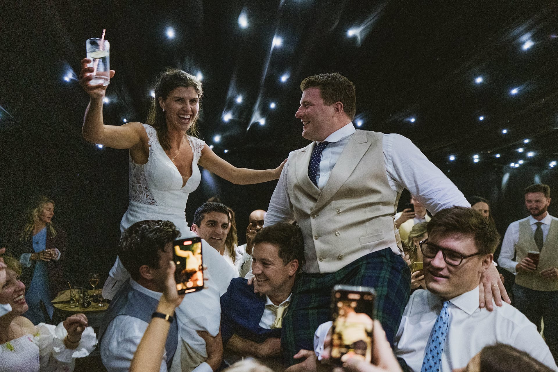 Bride and groom celebrating at a wedding party.