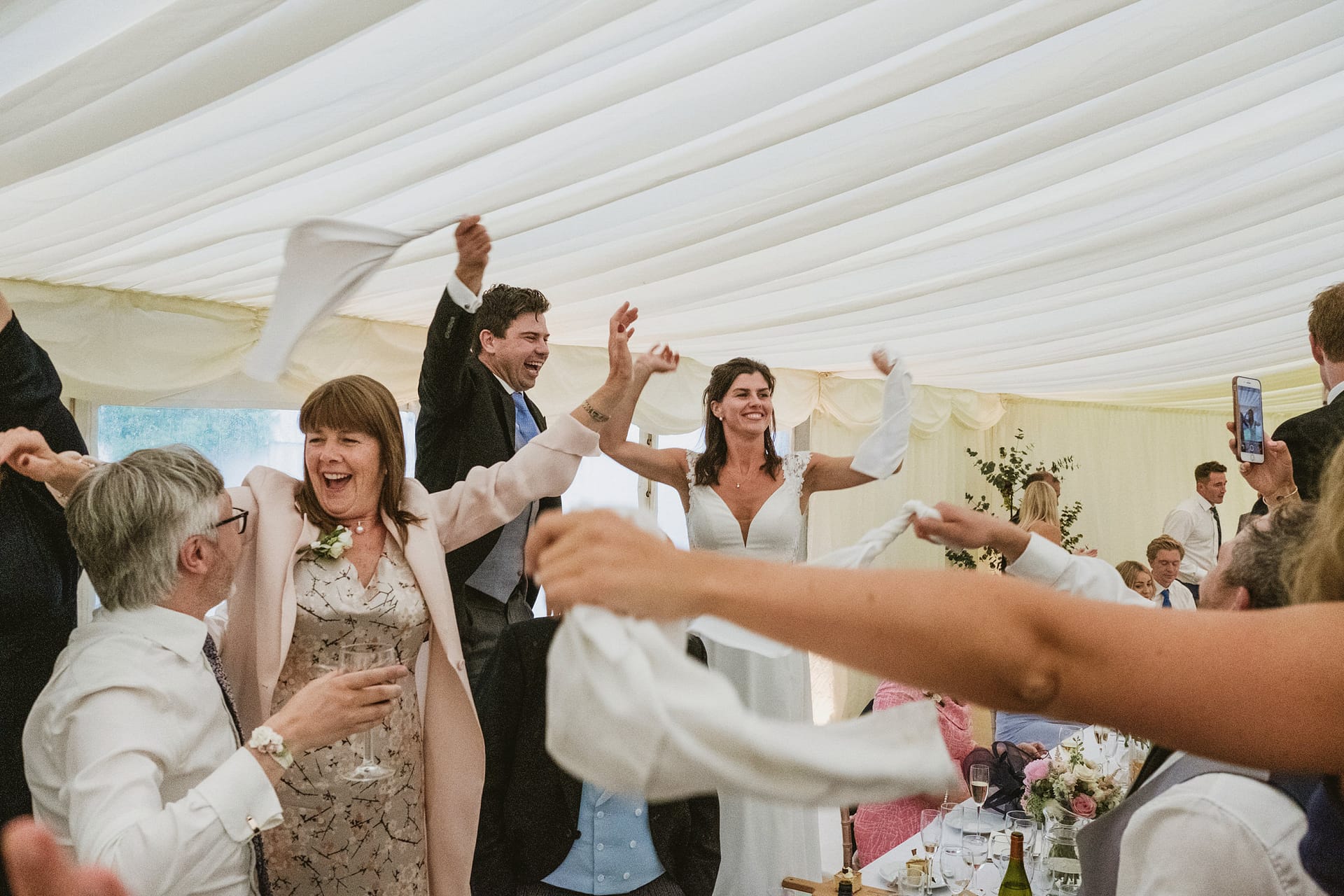 Guests celebrating at a wedding reception.
