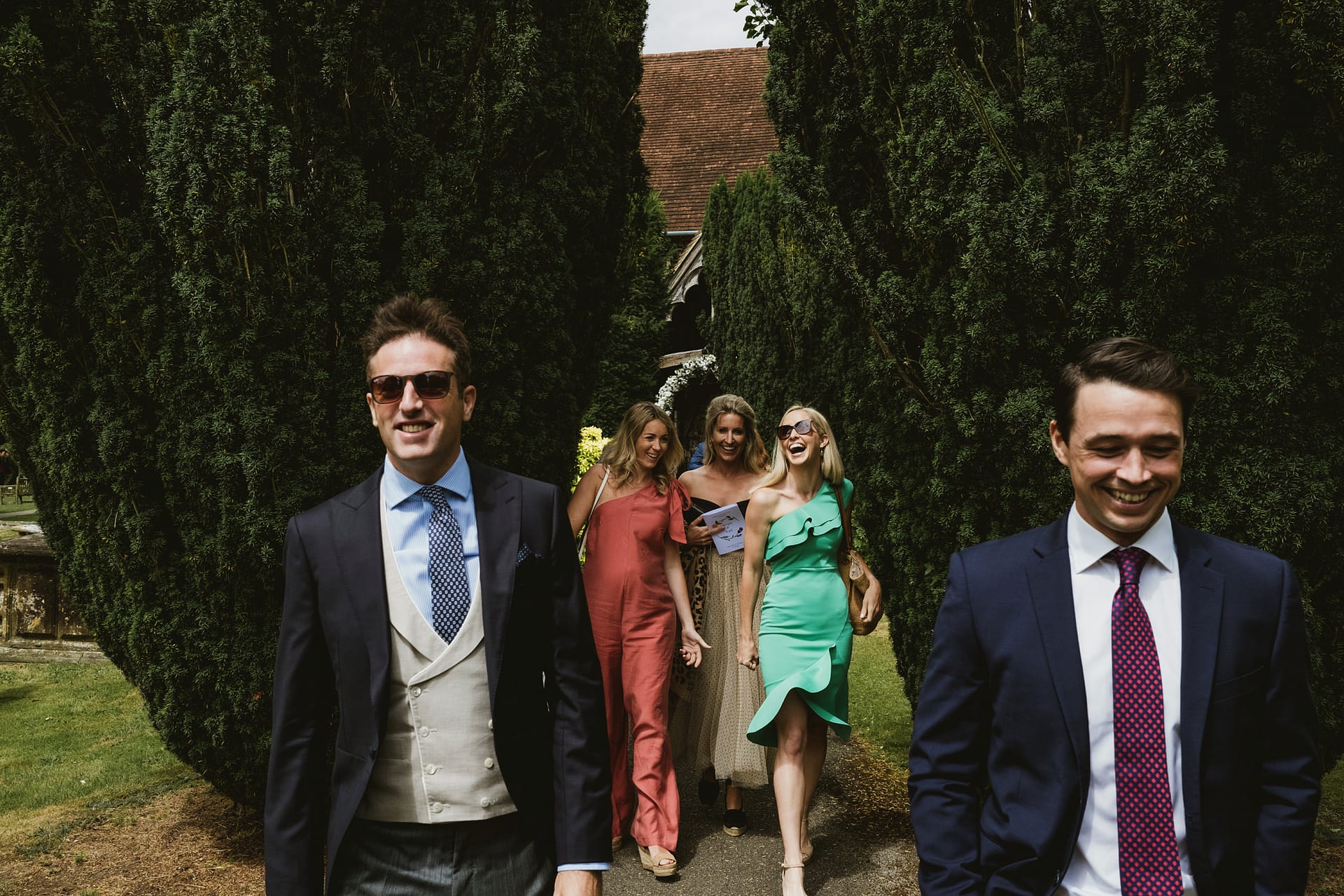 Group of people walking outdoors dressed formally