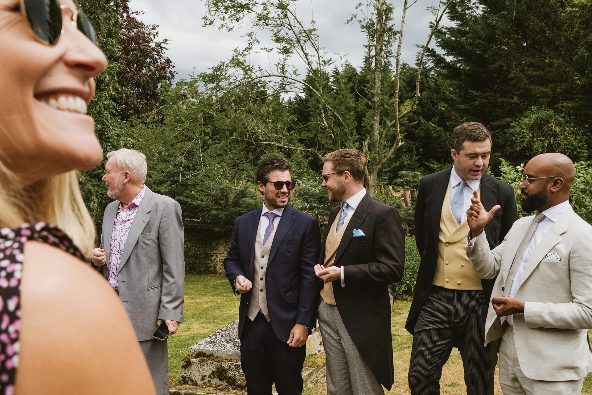 Group of people dressed formally outdoors.