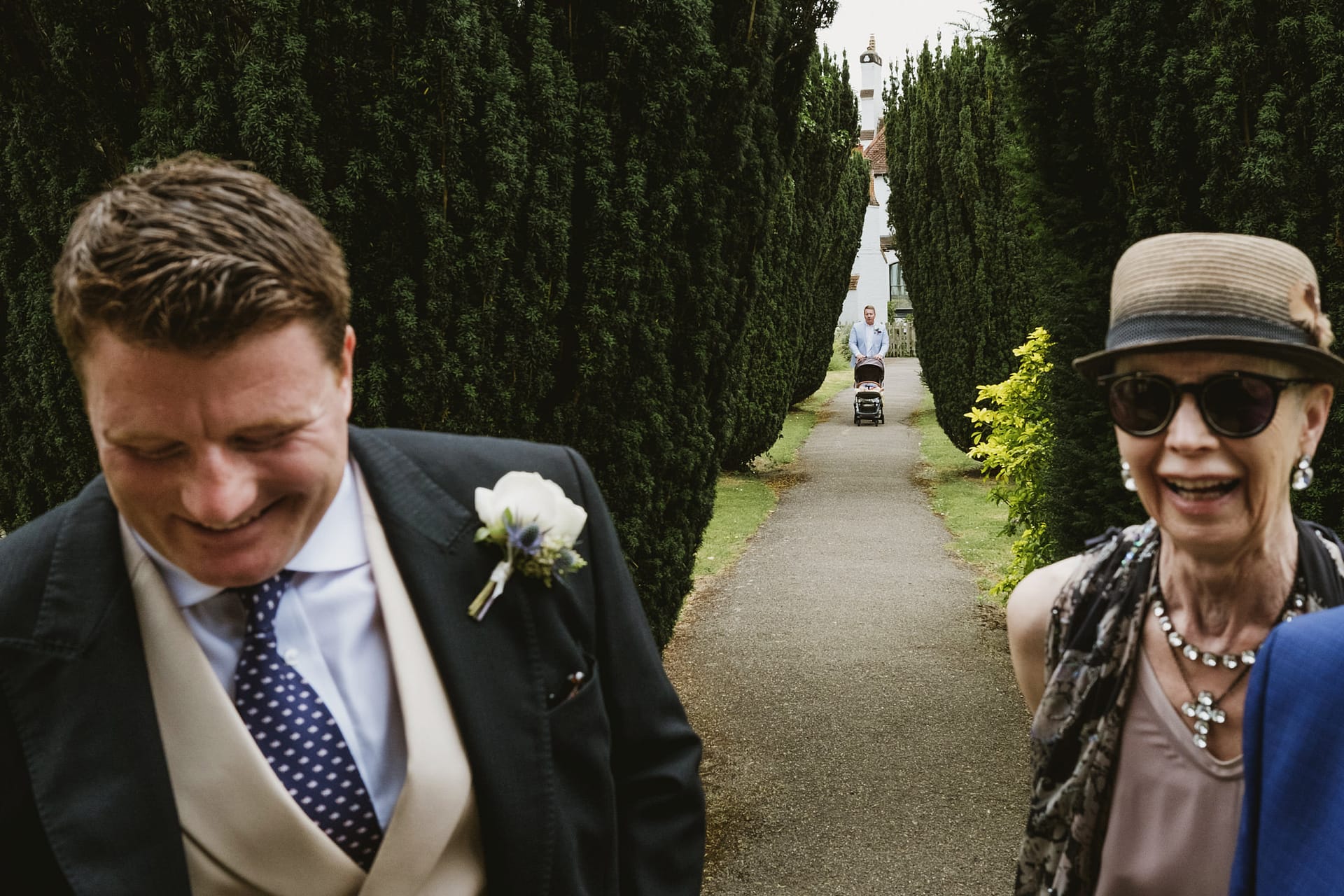 groom and guest wait outside the church in Buckinghamshire