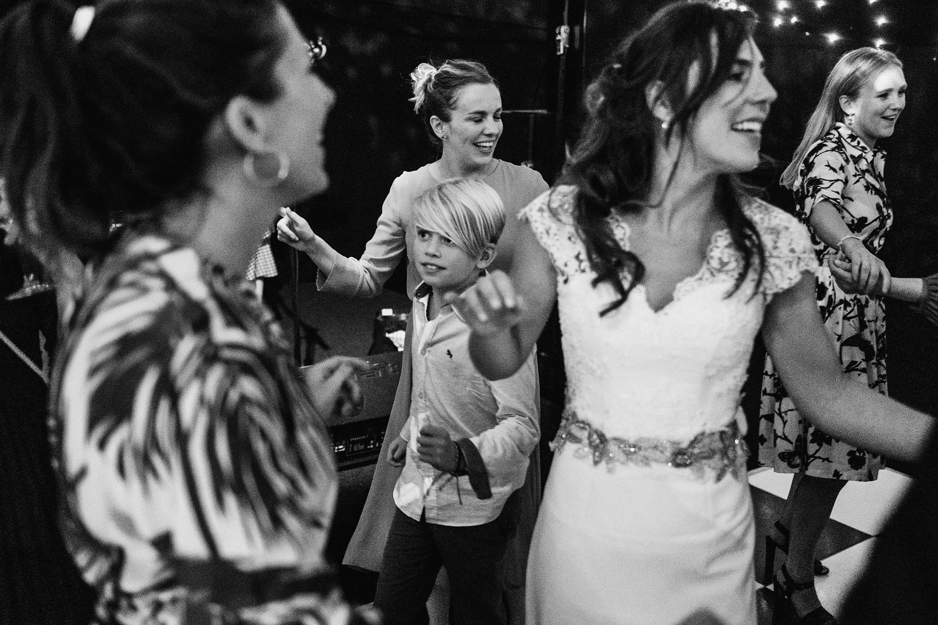 bride on dance floor with friends