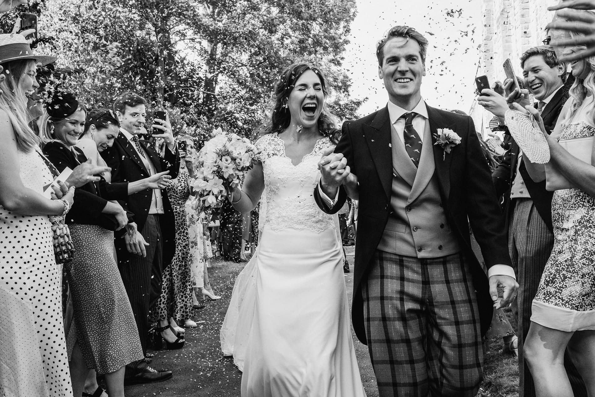 bride and groom cheshire wedding with confetti