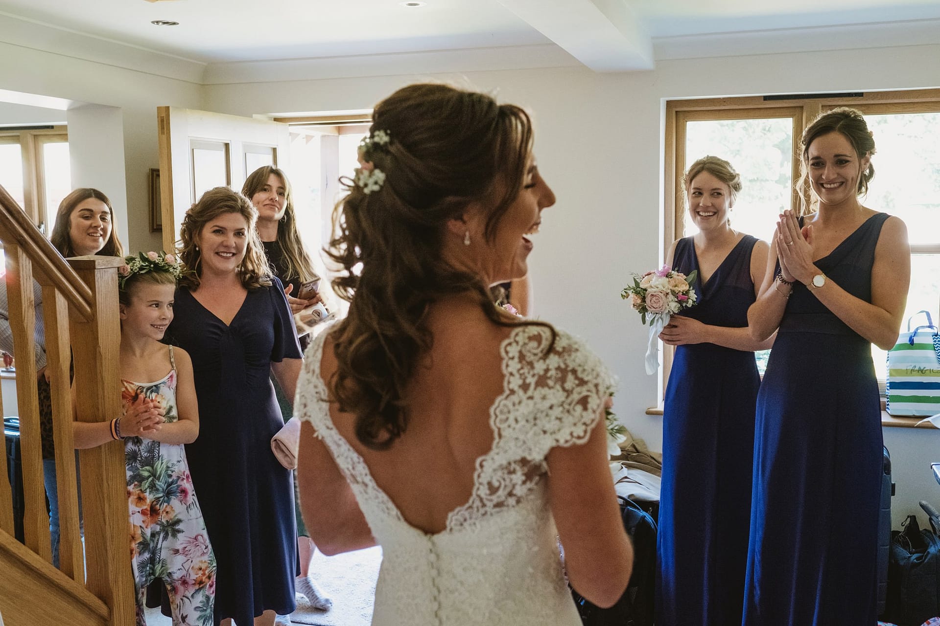 bridesmaids seeing the bride for the first time