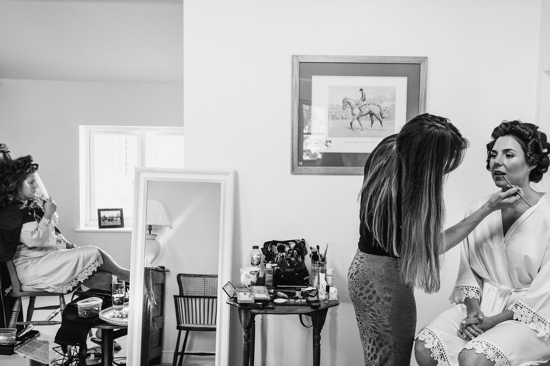bride having her make up done in the house