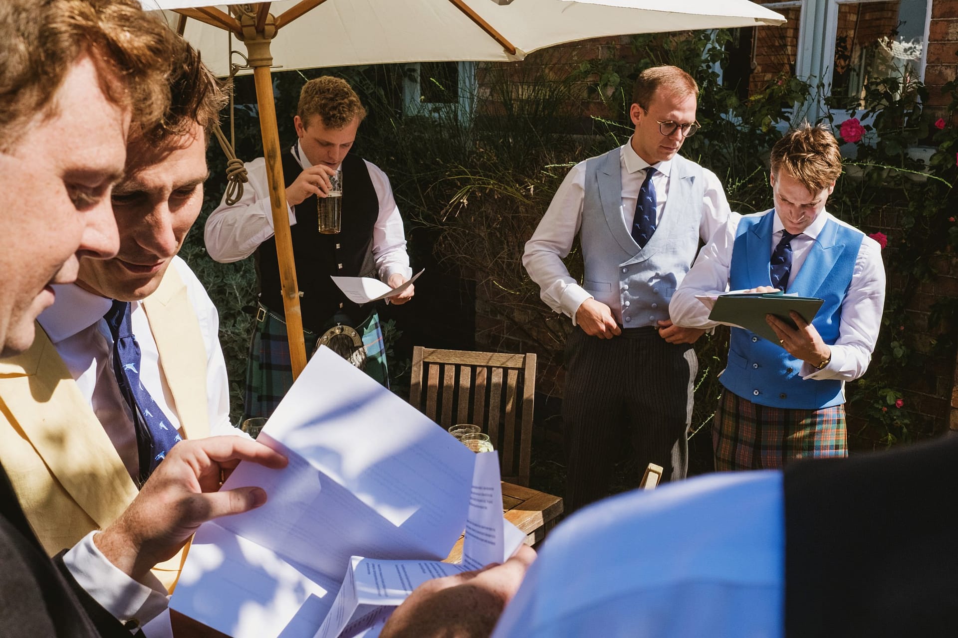 groomsmen and groom checking schedule