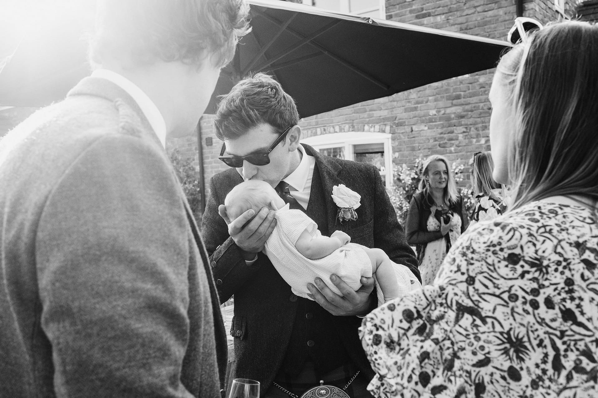 wedding guest kissing baby