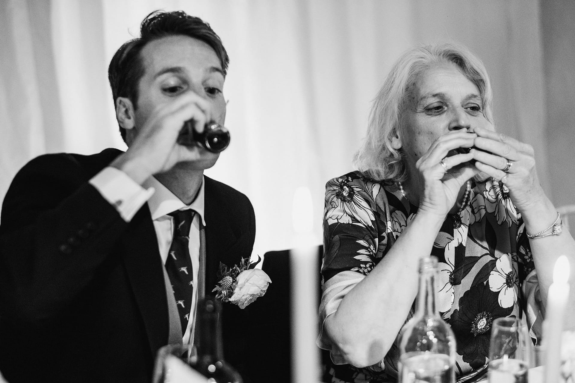 groom and groom's mum having a shot together
