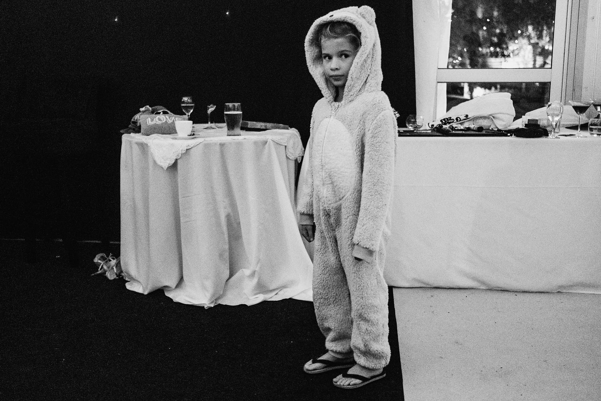 flower girl in animal onesie