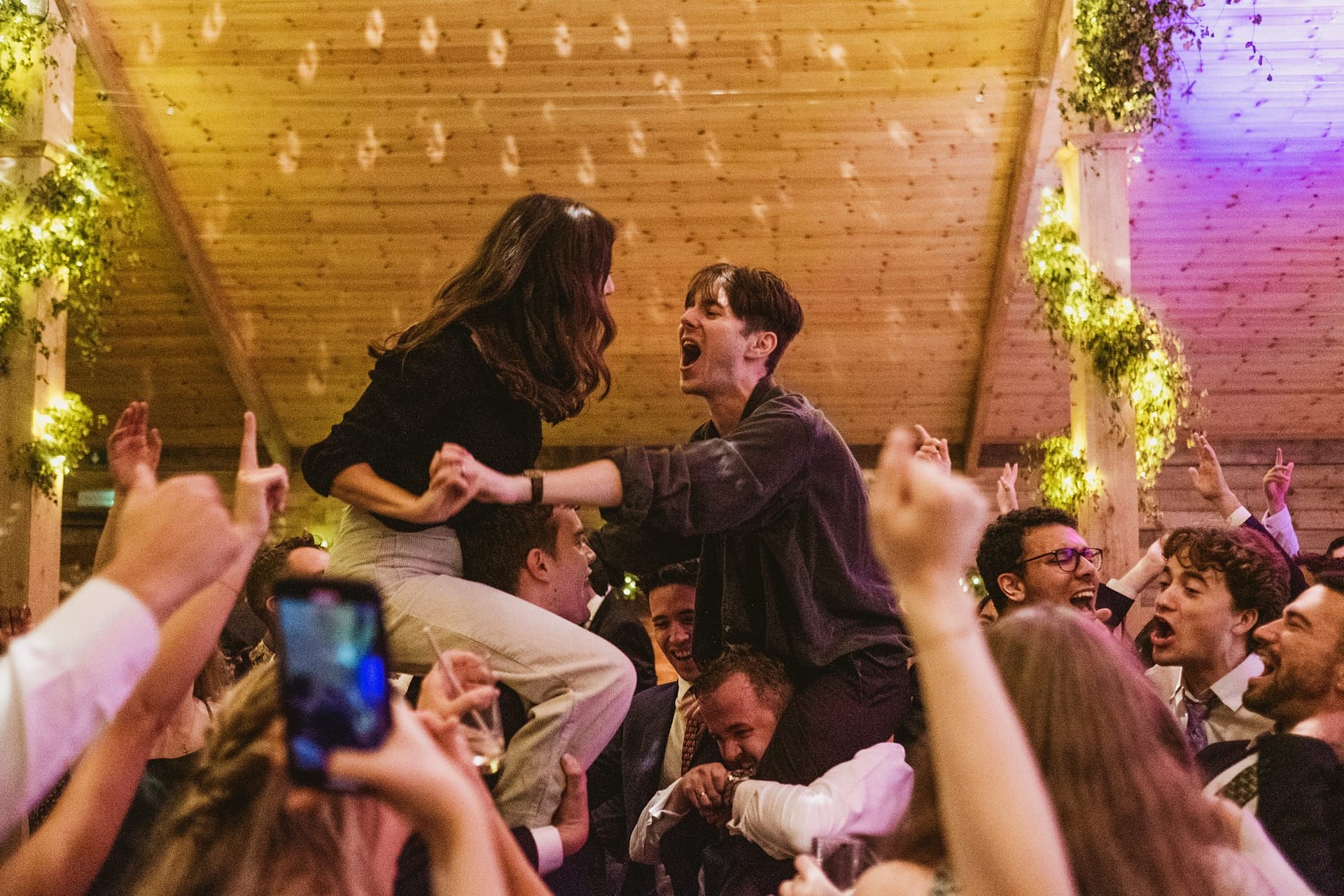 bride and groom on shoulders on dance floor at high billinghurst farm