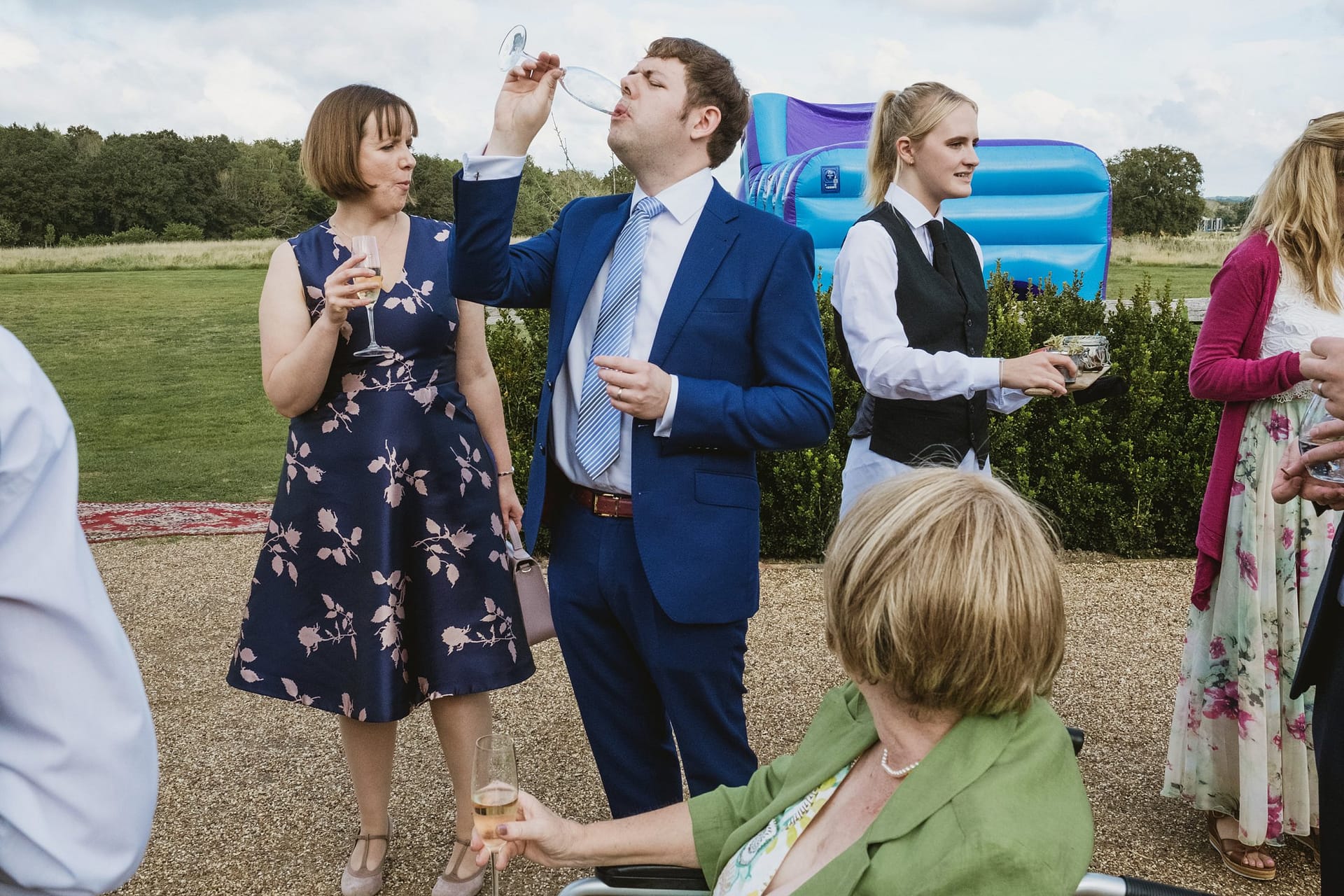wedding guests drinking prosecco at high billinghurst farm